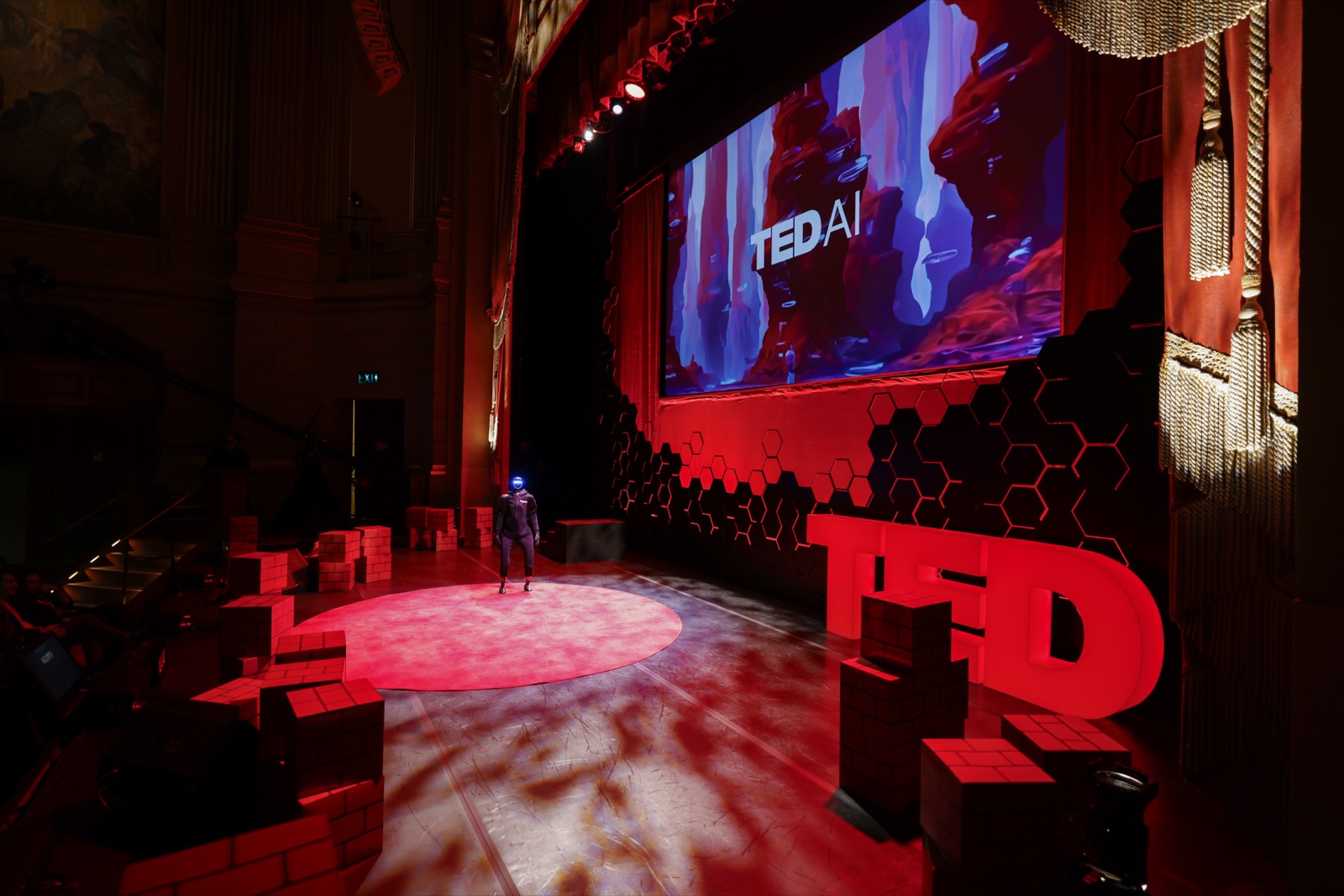 TED AI main stage under dramatic lighting with the TEDAI screen